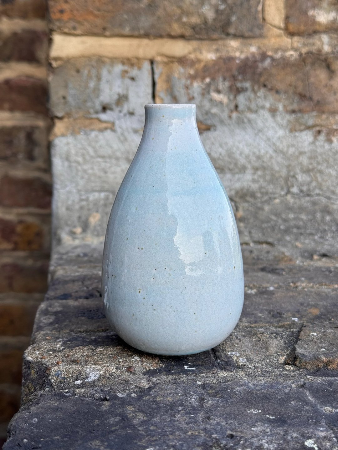 Teardrop shaped vase, pale turquoise on speckled clay, view 1
