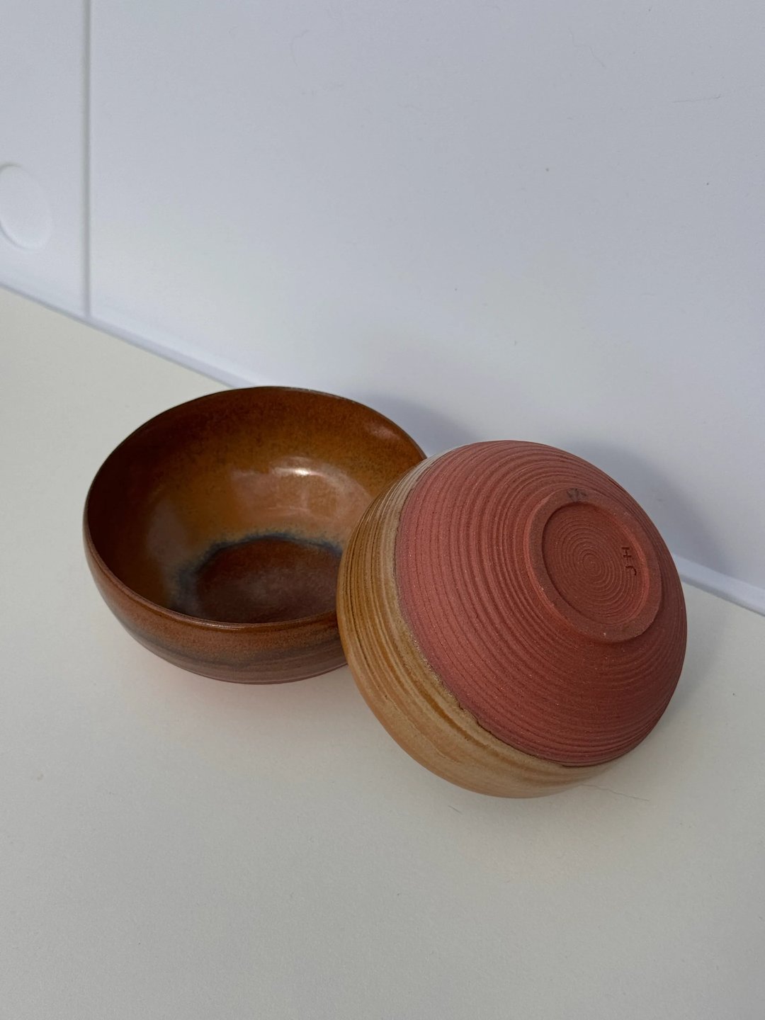 Small bowls with carved lines, caramel glaze on red clay, view 1