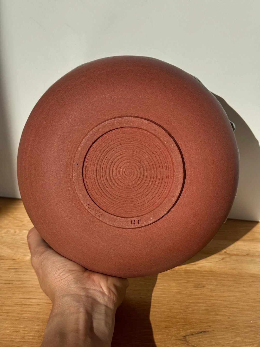 Large bowl with drippy glaze, unglazed red clay outside, misty blue inside, view 3