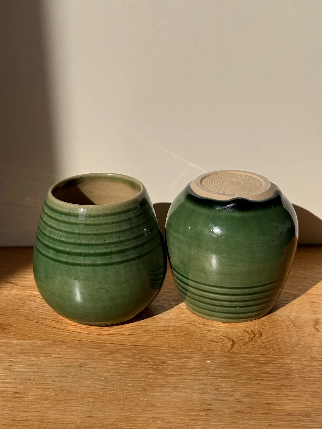 Egg-shaped cups with carved ridges, celadon green, view 1