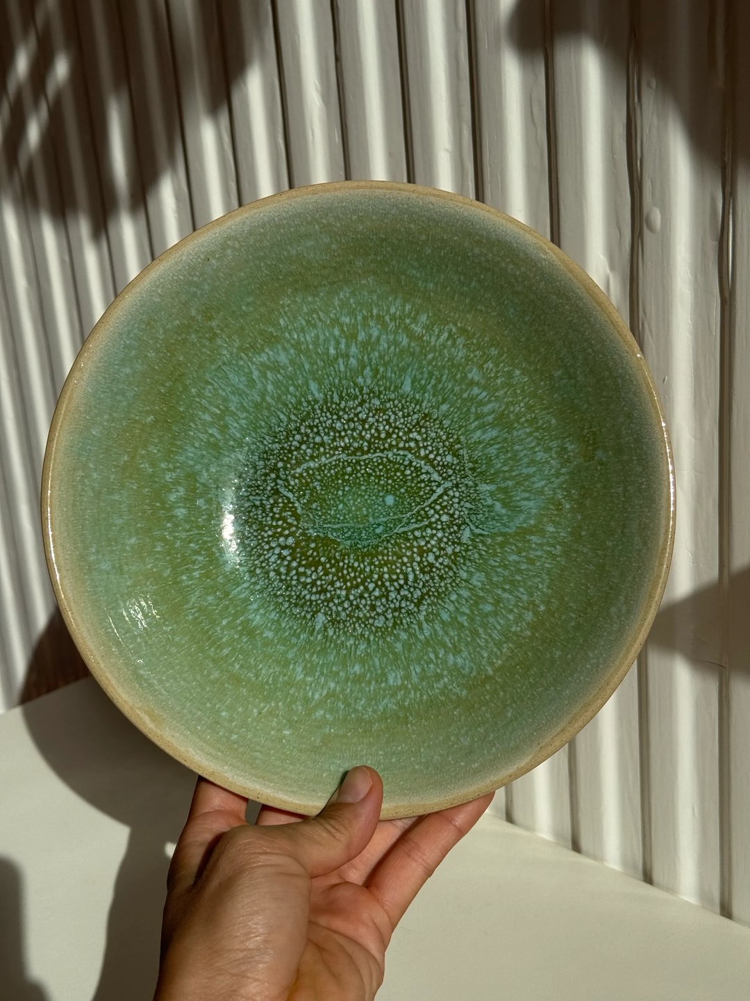 Curved wide plate, oatmeal outside, speckled sea glass inside, view 1