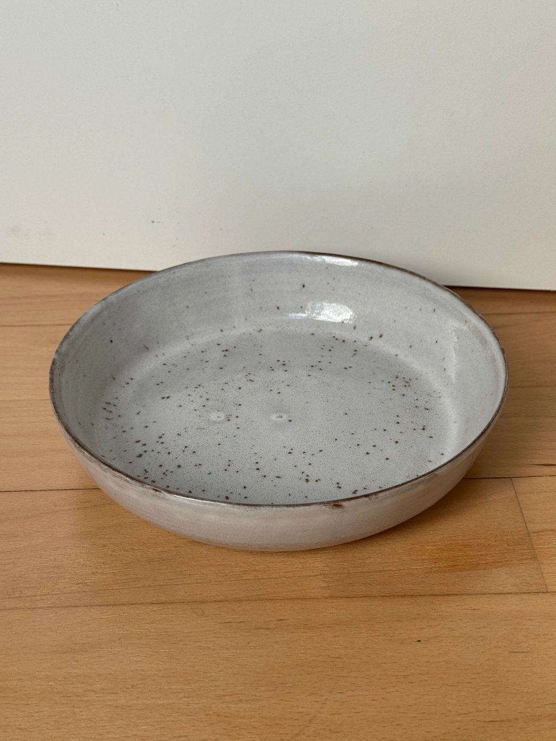 Serving plates, speckled white on red clay, view 2